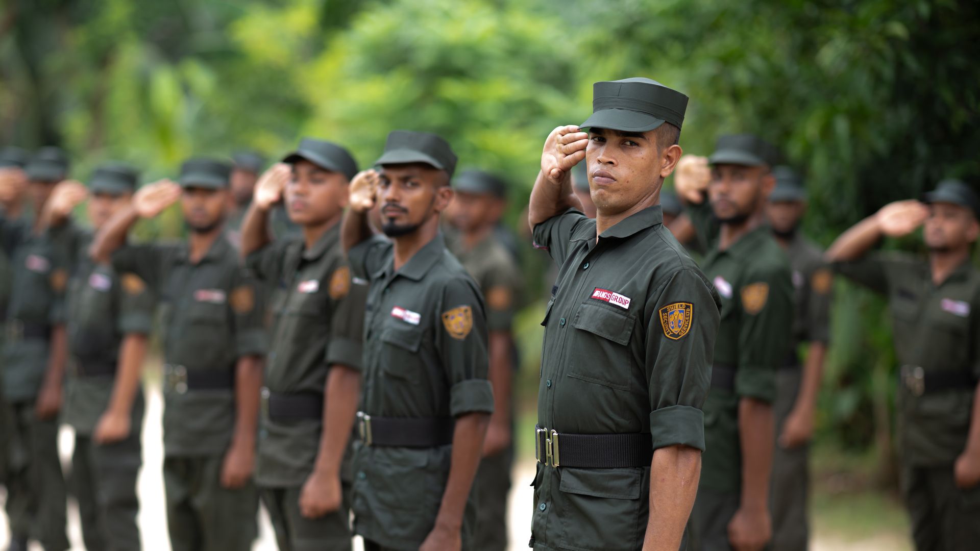 SSSL security guards saluting on parade